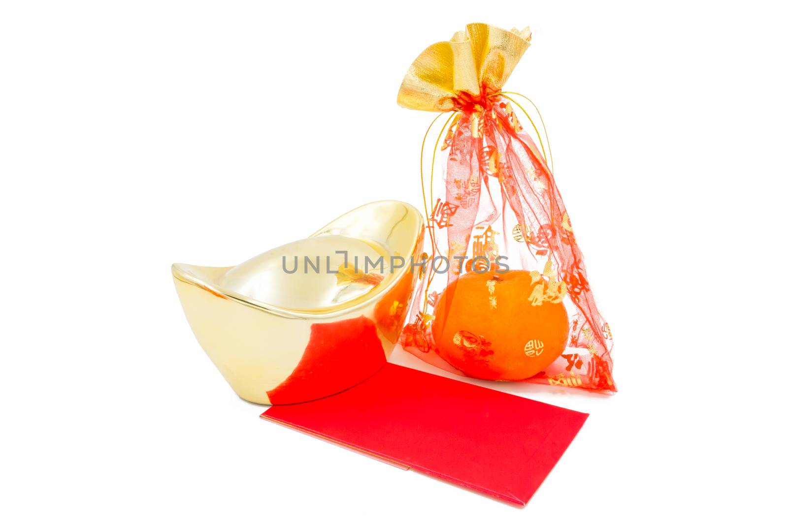 concept image of the chinese new year - Gold Ingot ,red packet and mandarin orange in the red auspicious bag