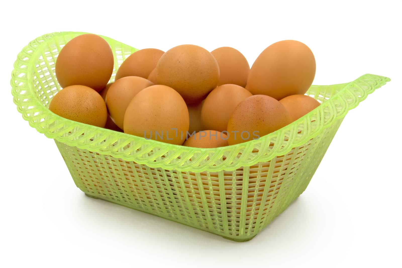 Eggs in basket isolated on white background by ronnarong