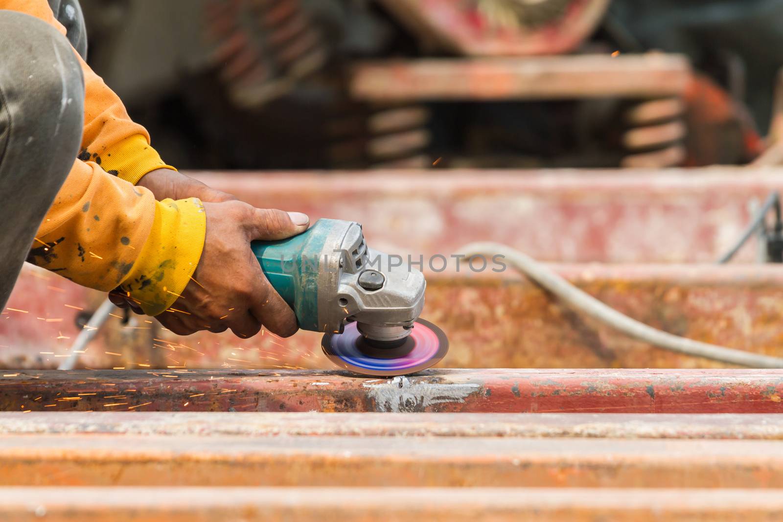 Steel Workers welding, grinding, cutting in metal industry