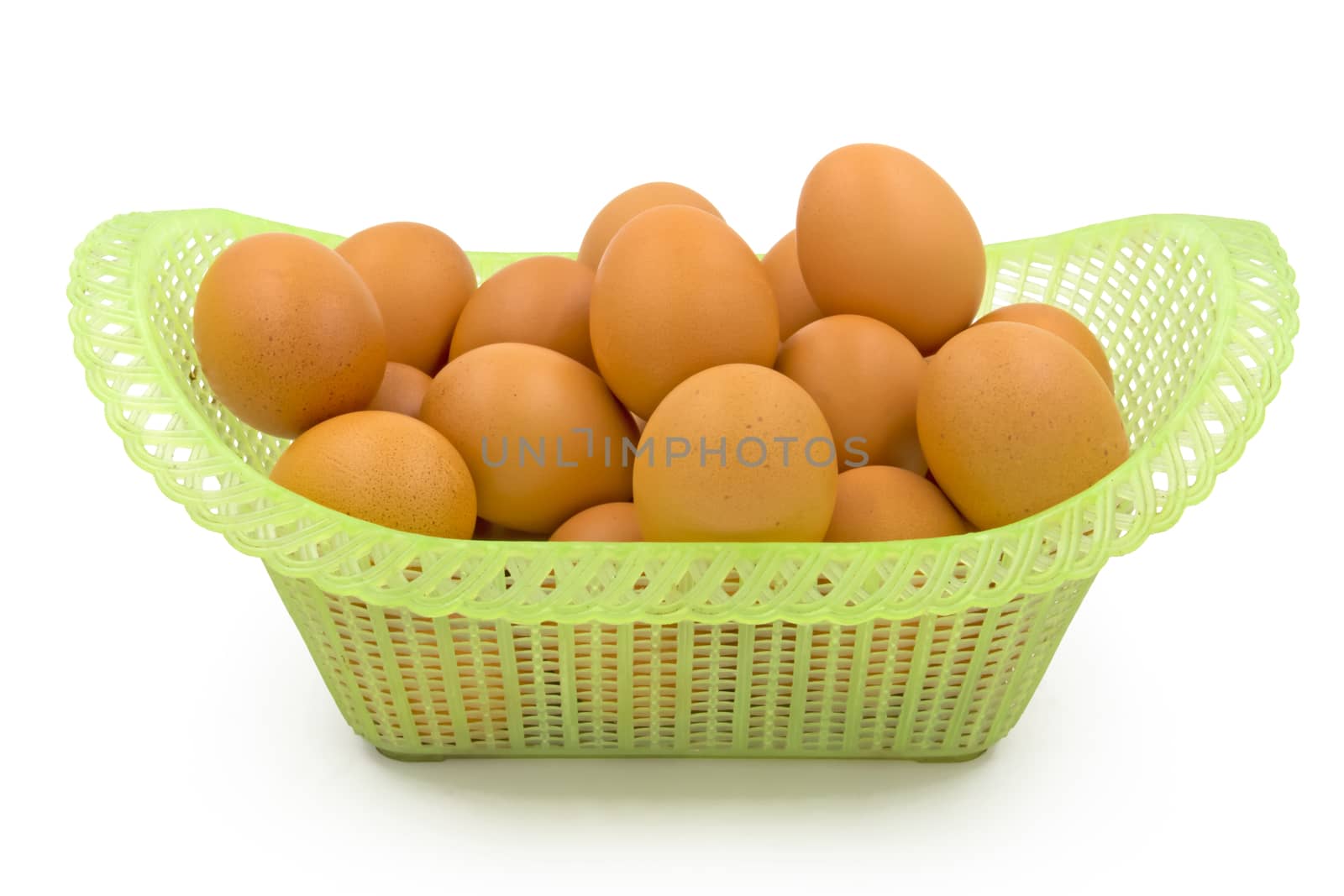 Eggs in basket isolated on white background