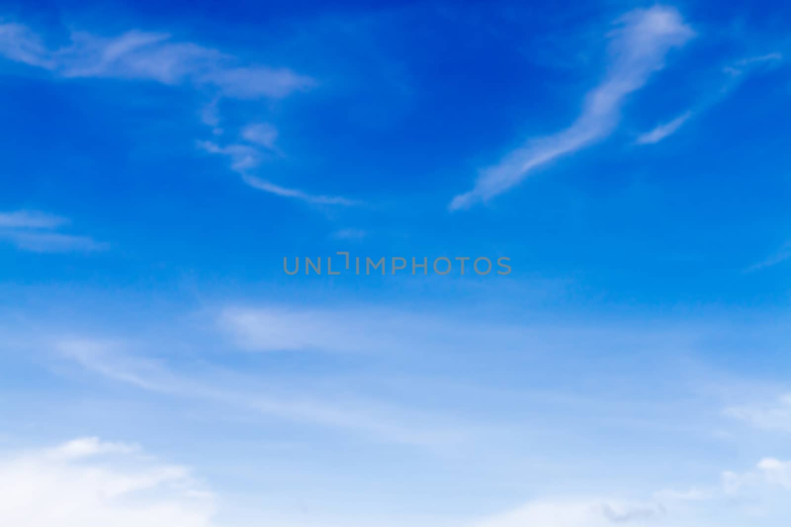 Blue sky background with white clouds.Blur or Defocus image. by ronnarong