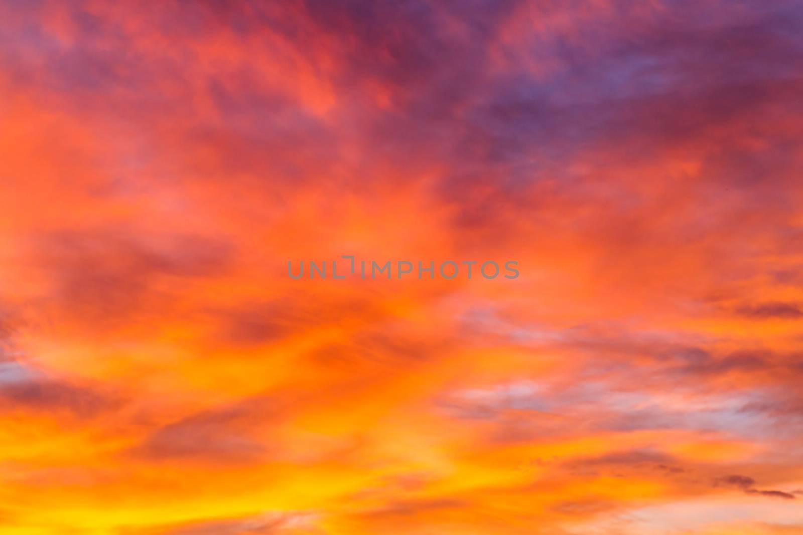 Dramatic sunrise sky with clouds.Blur or Defocus image. by ronnarong