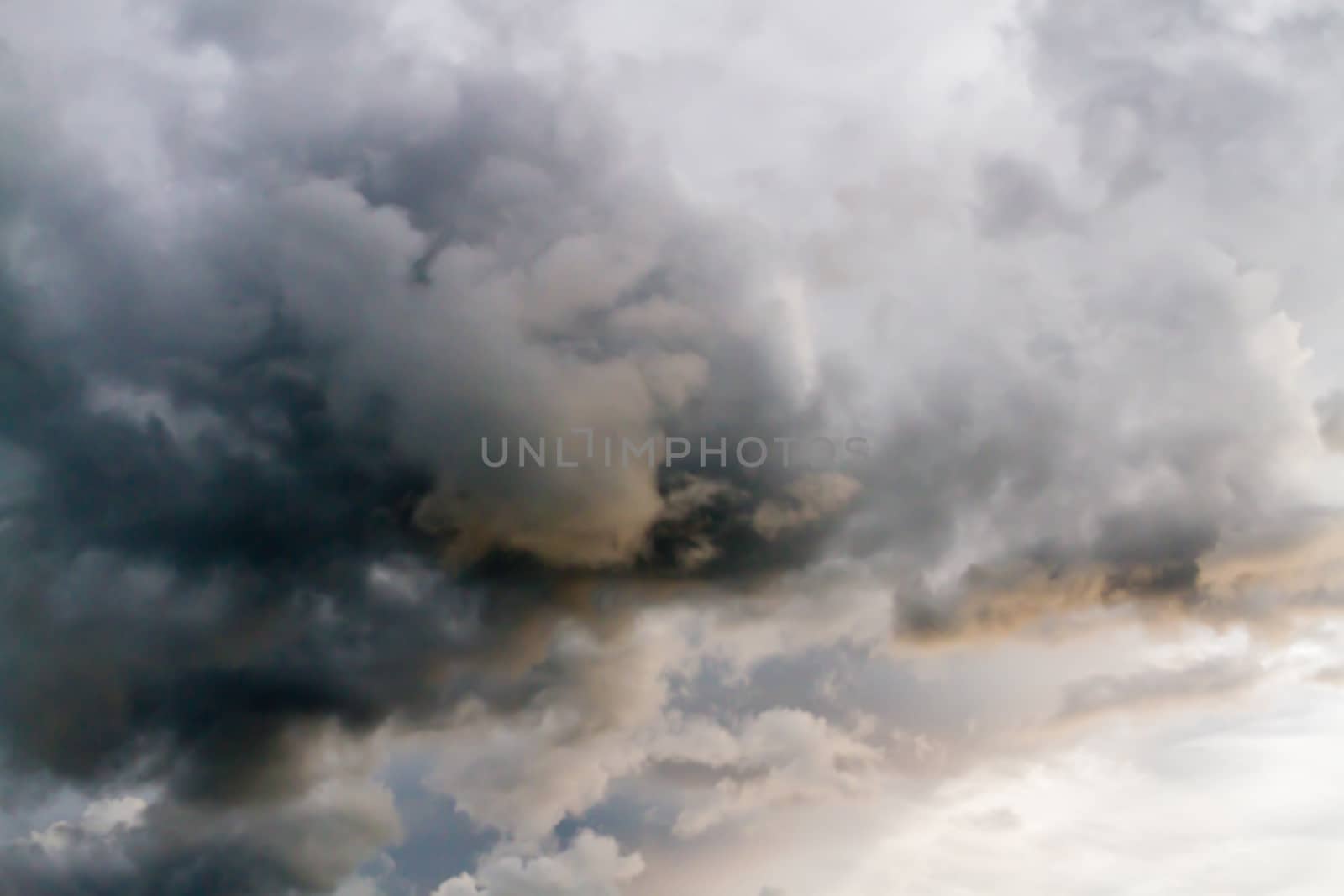 Dramatic and dark sky with storm clouds.Blur or Defocus image by ronnarong