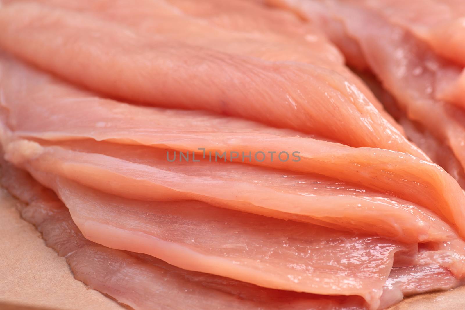 Raw sliced chicken meat close-up.Close-up view of raw, fresh, choped and sliced chicken meat. Sotilissimo. Delicious dietary meat. Cooking. by nkooume