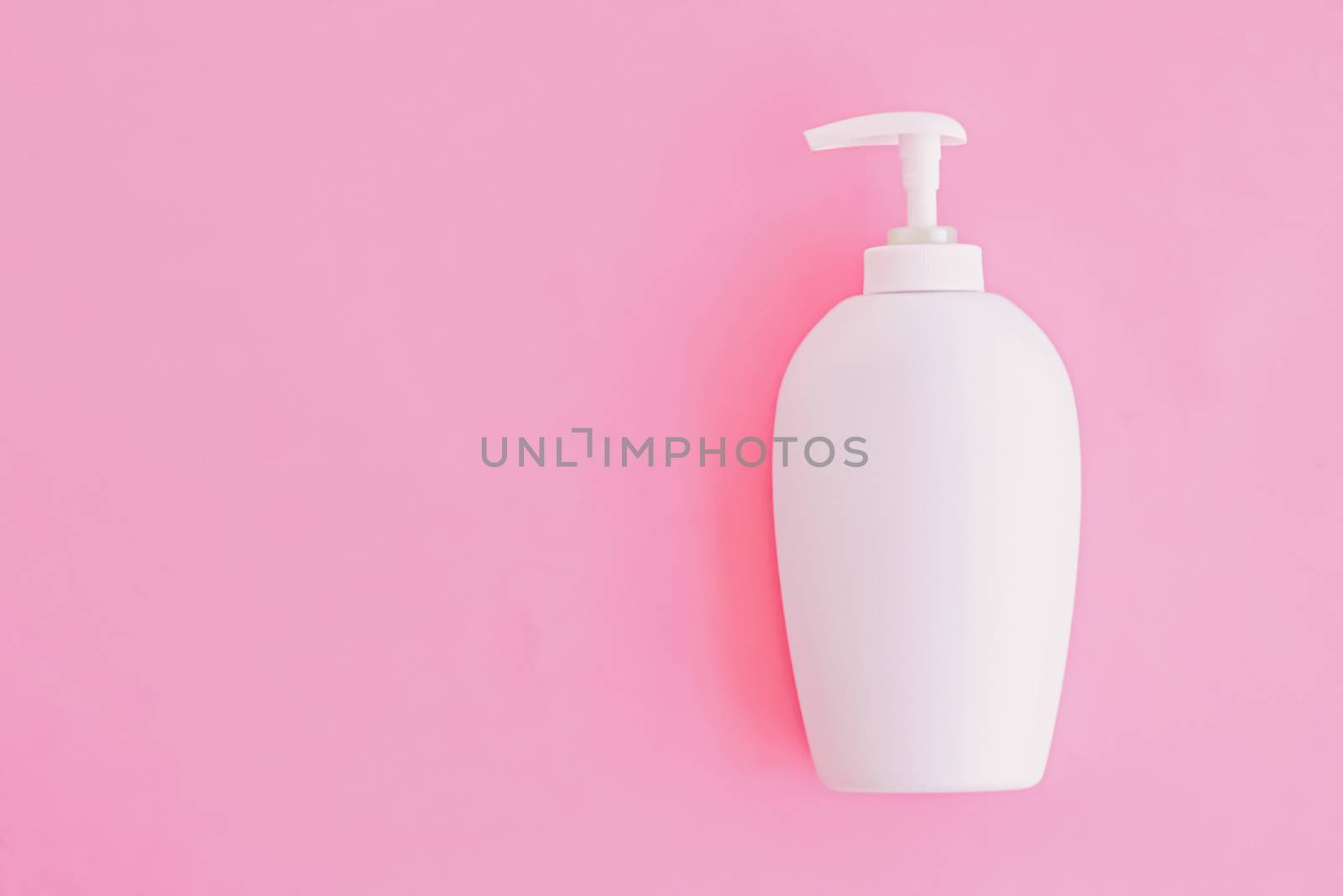 Bottle of antibacterial liquid soap and hand sanitizer on pink background, hygiene product and healthcare, flatlay