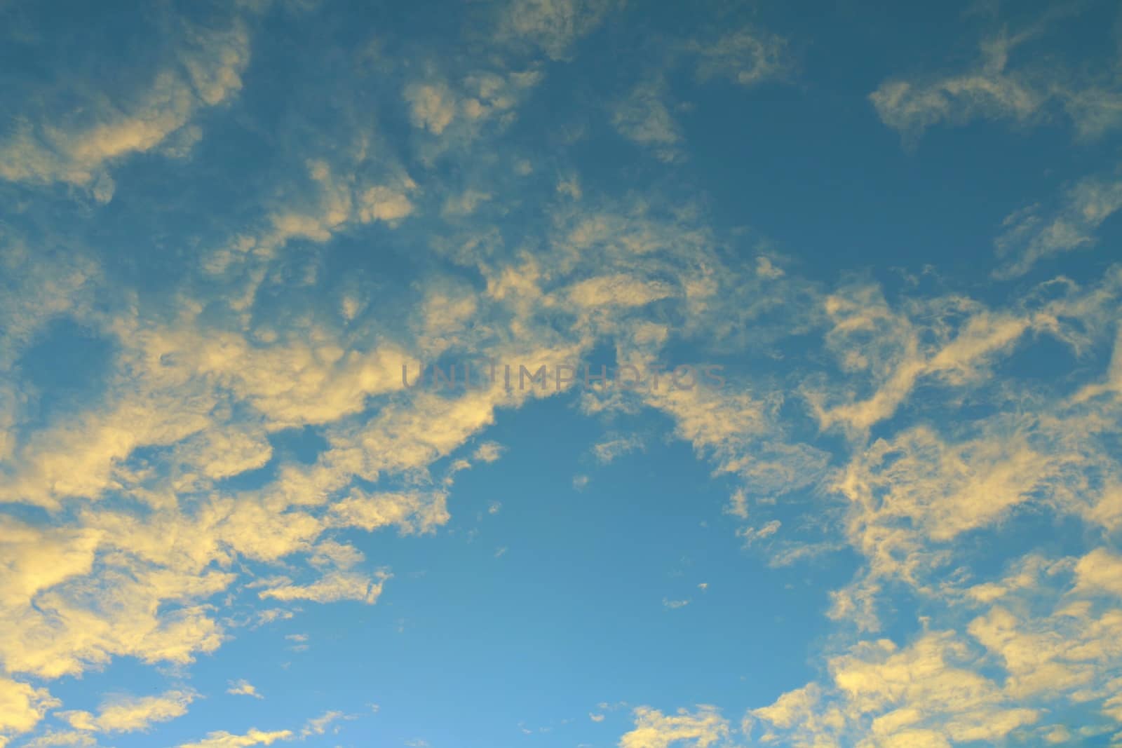 Global warming, twilight sky evening time, sunshine yellow gold on cloud blue sky background