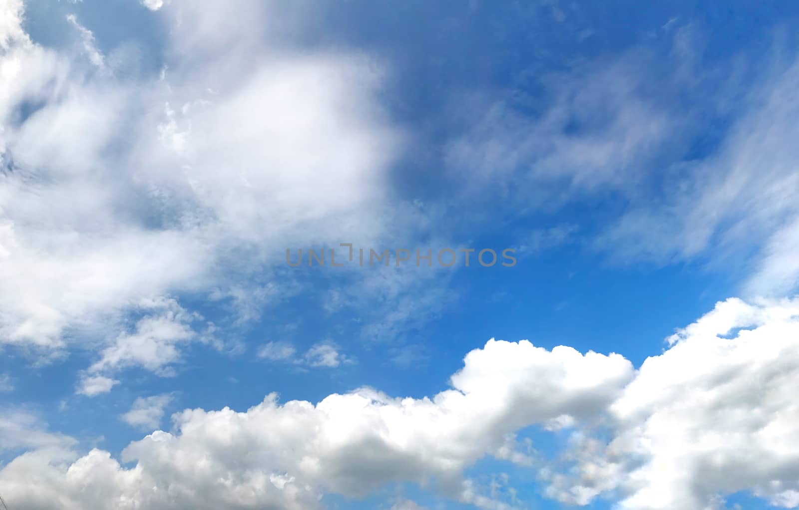 Beautiful blue sky with clouds for background and bright lighting clear on Summer