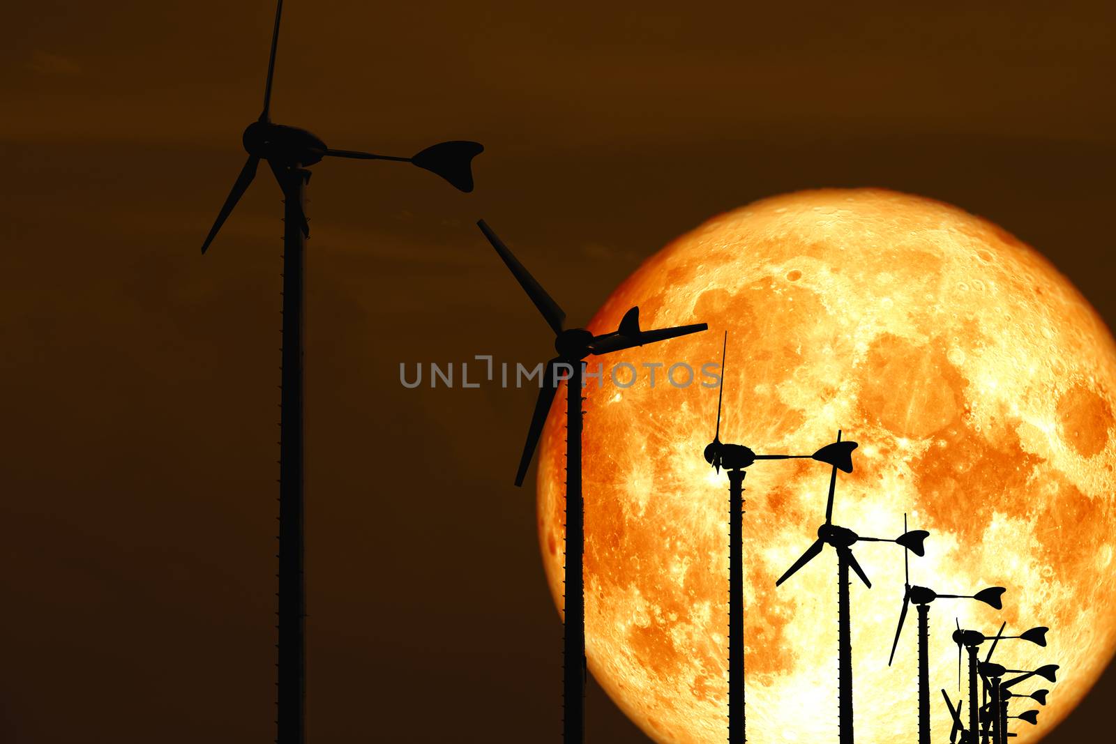 blood moon back Wind turbines produce wind energy which is a clean energy, Elements of this image furnished by NASA