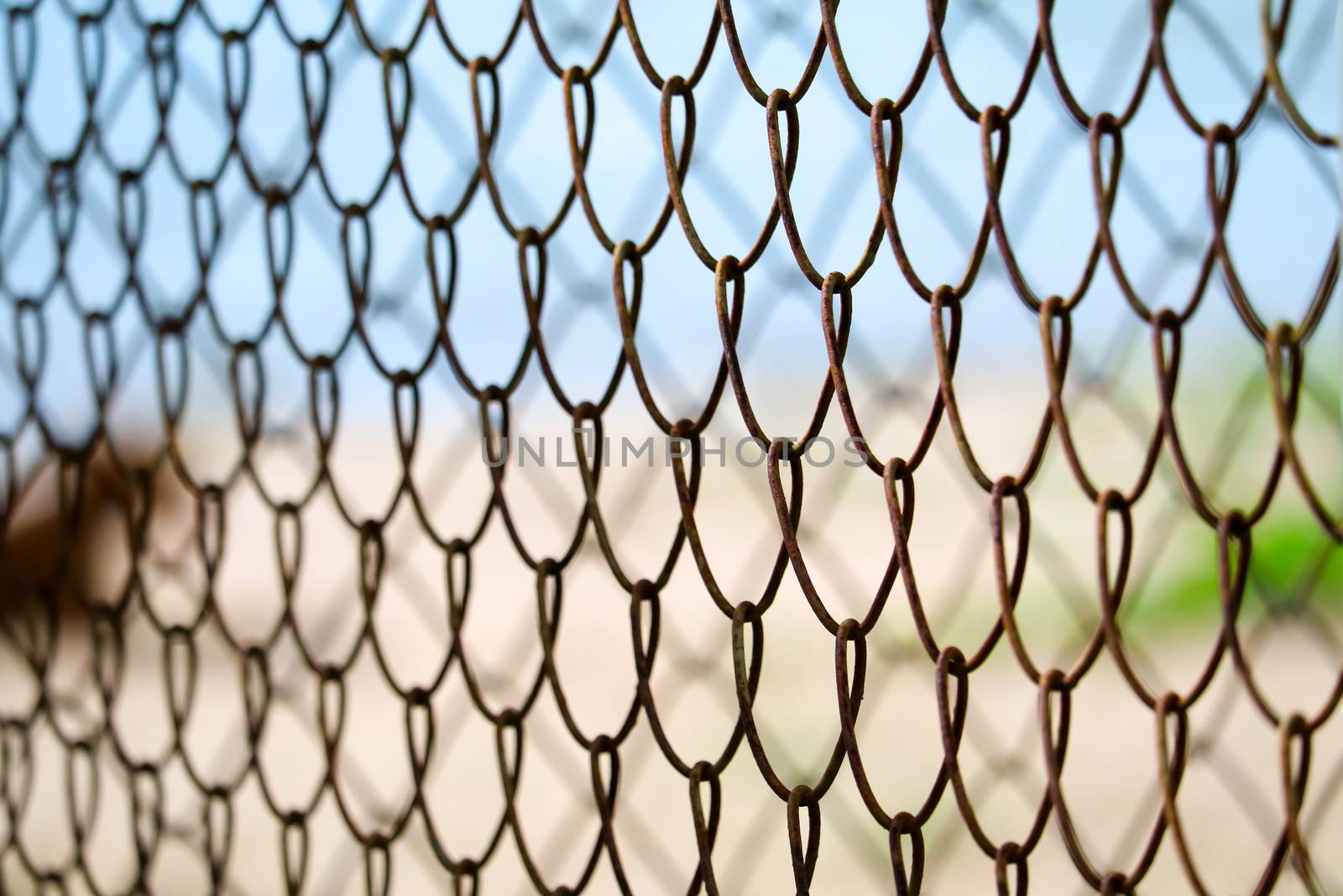 Steel wire fence to prevent dangerous areas along the beach and blur background