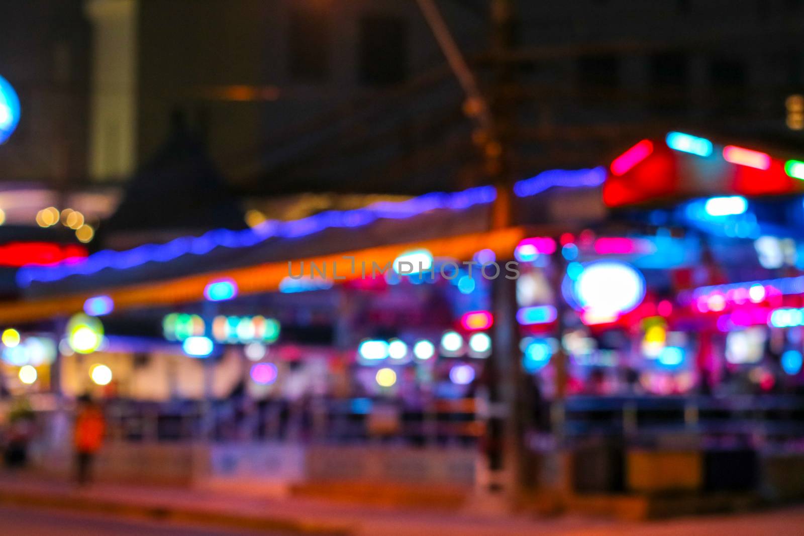 blur colorful of nightlight at night market in pattaya city