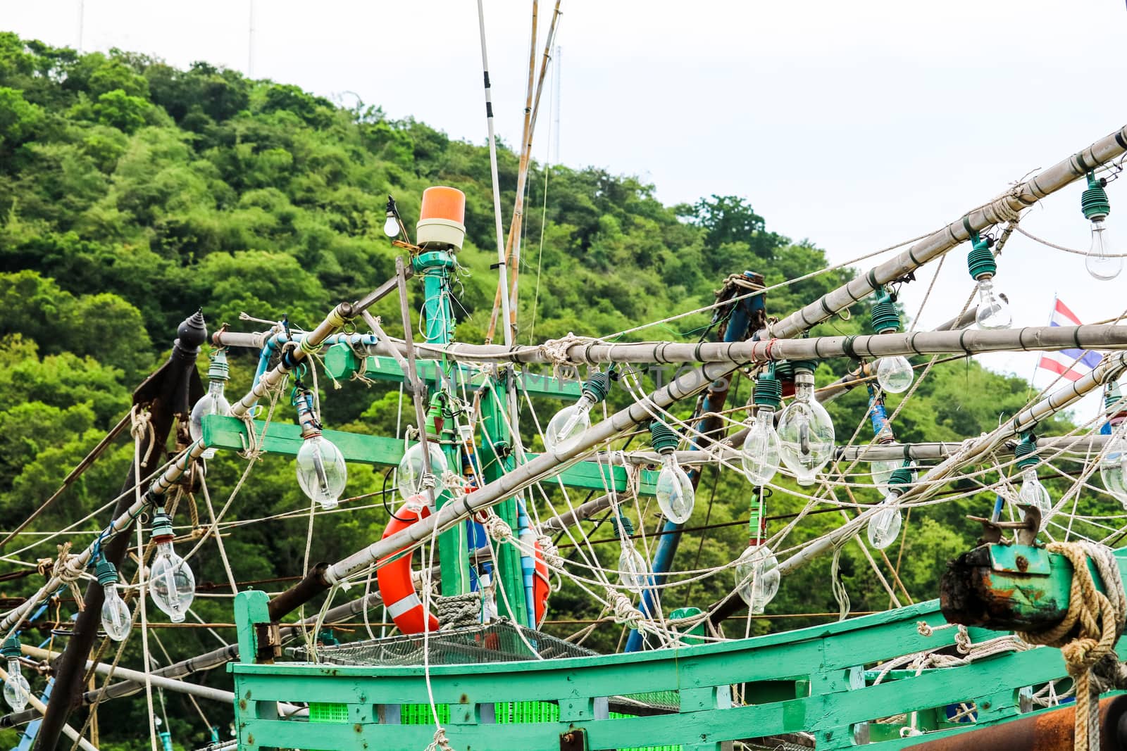 Spotlights was hanging on a fishing boat and squid fishing to catch the fish in the night