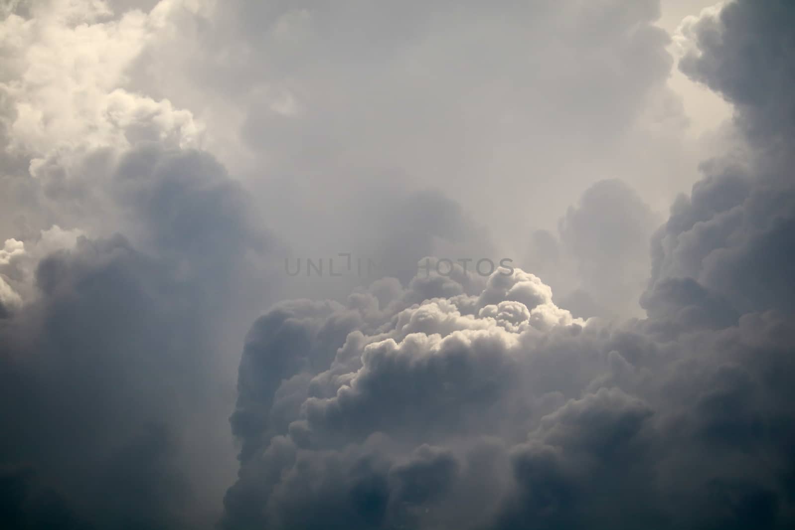 storm silhouette heap cloud sun ray in gray skyscape dark cloud background