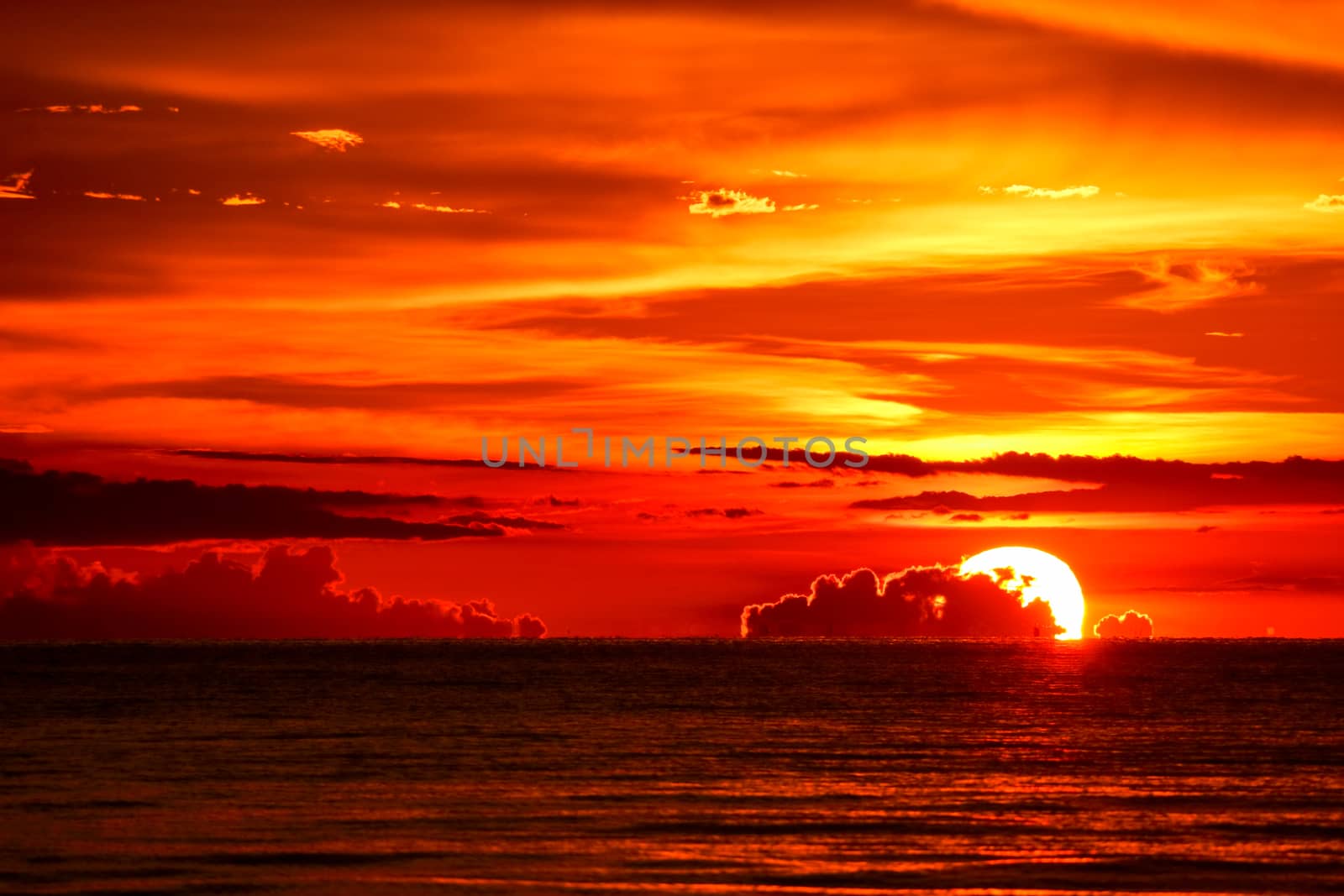 sunset on sea and ocean last light red sky silhouette cloud