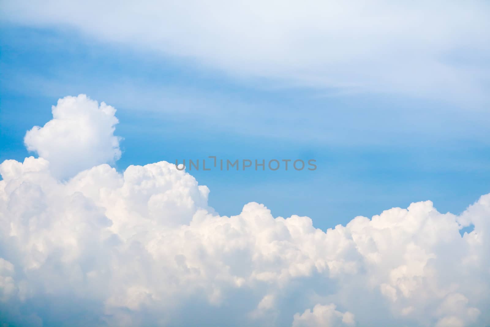 white huge heap cloud sunshine in summer blue sky soft cloud background