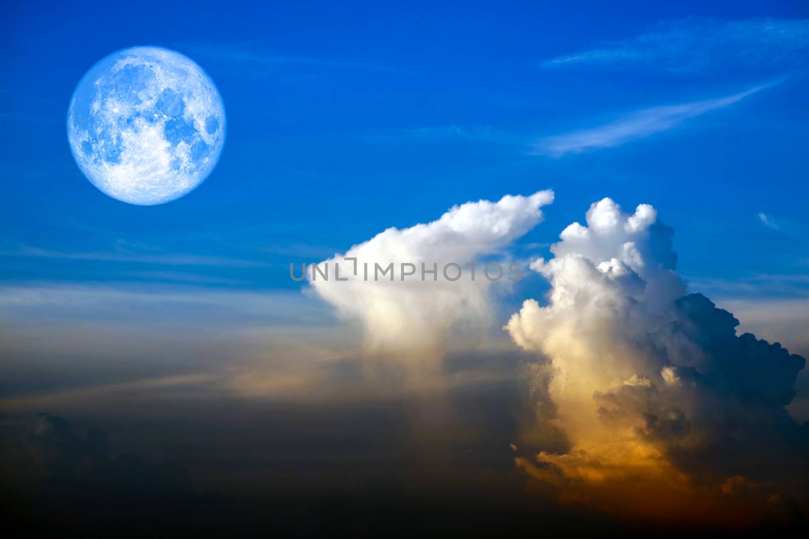 full worm moon back on silhouette heap cloud on sunset sky, Elements of this image furnished by NASA