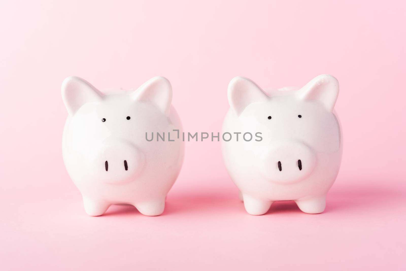 International Friendship Day, Front two small white fat piggy bank, studio shot isolated on pink background and copy space for use, Finance, deposit saving money concept