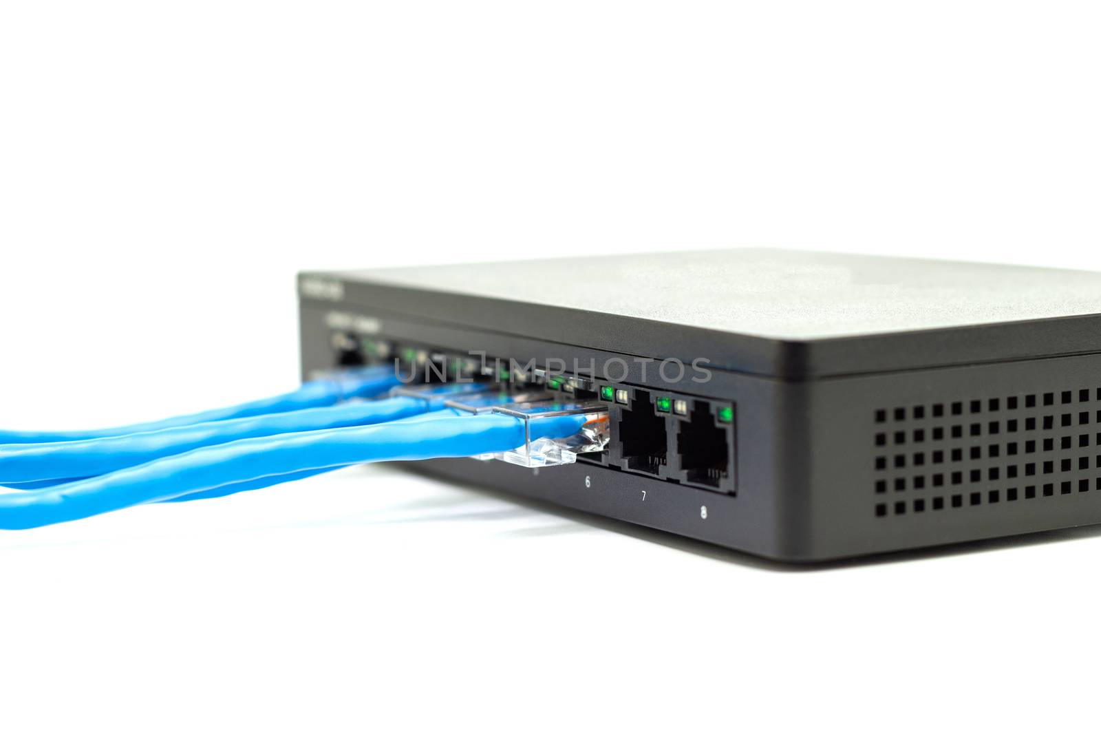 The blue network cables connect port switch on white table concept internet network connection