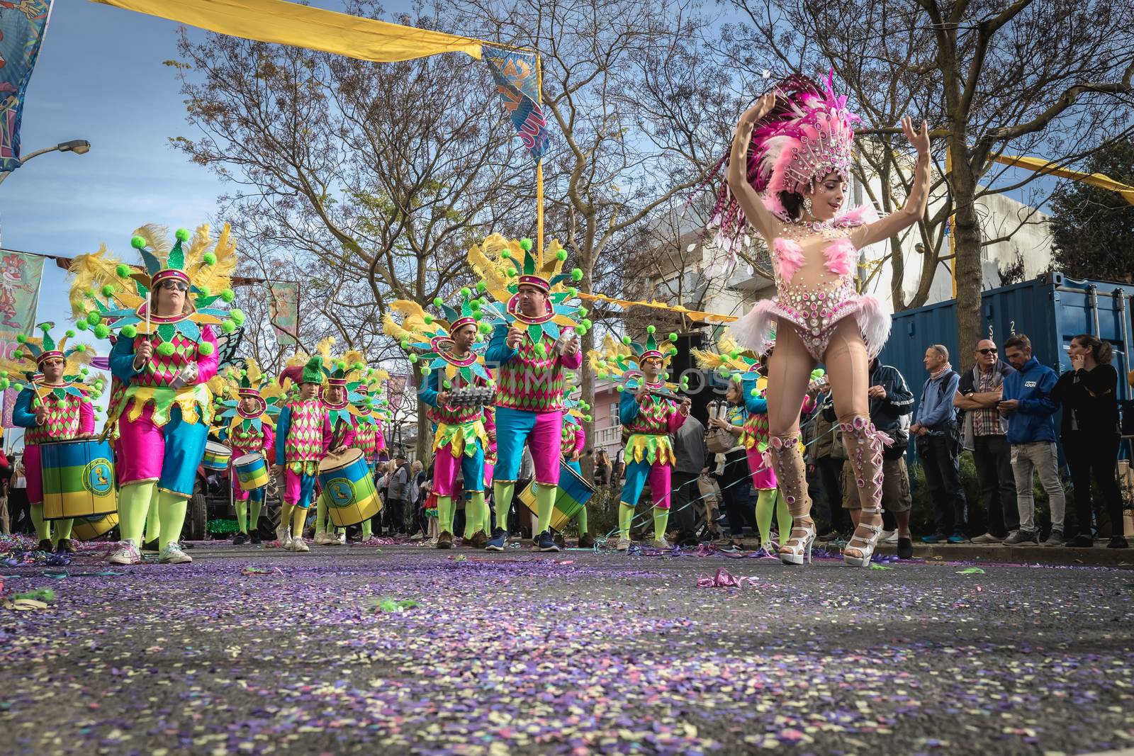 Loule, Portugal - February 25, 2020: percussionists parading in the street accompanying dancers in the parade of the traditional carnival of Loule city on a February day