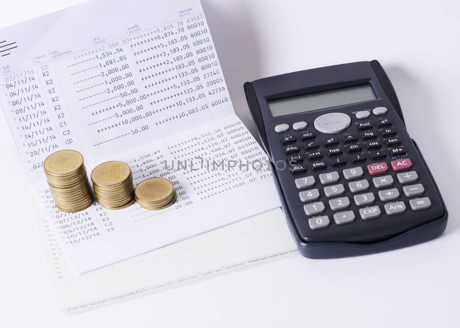 Money coins stack and calculator and book baank loan money concept