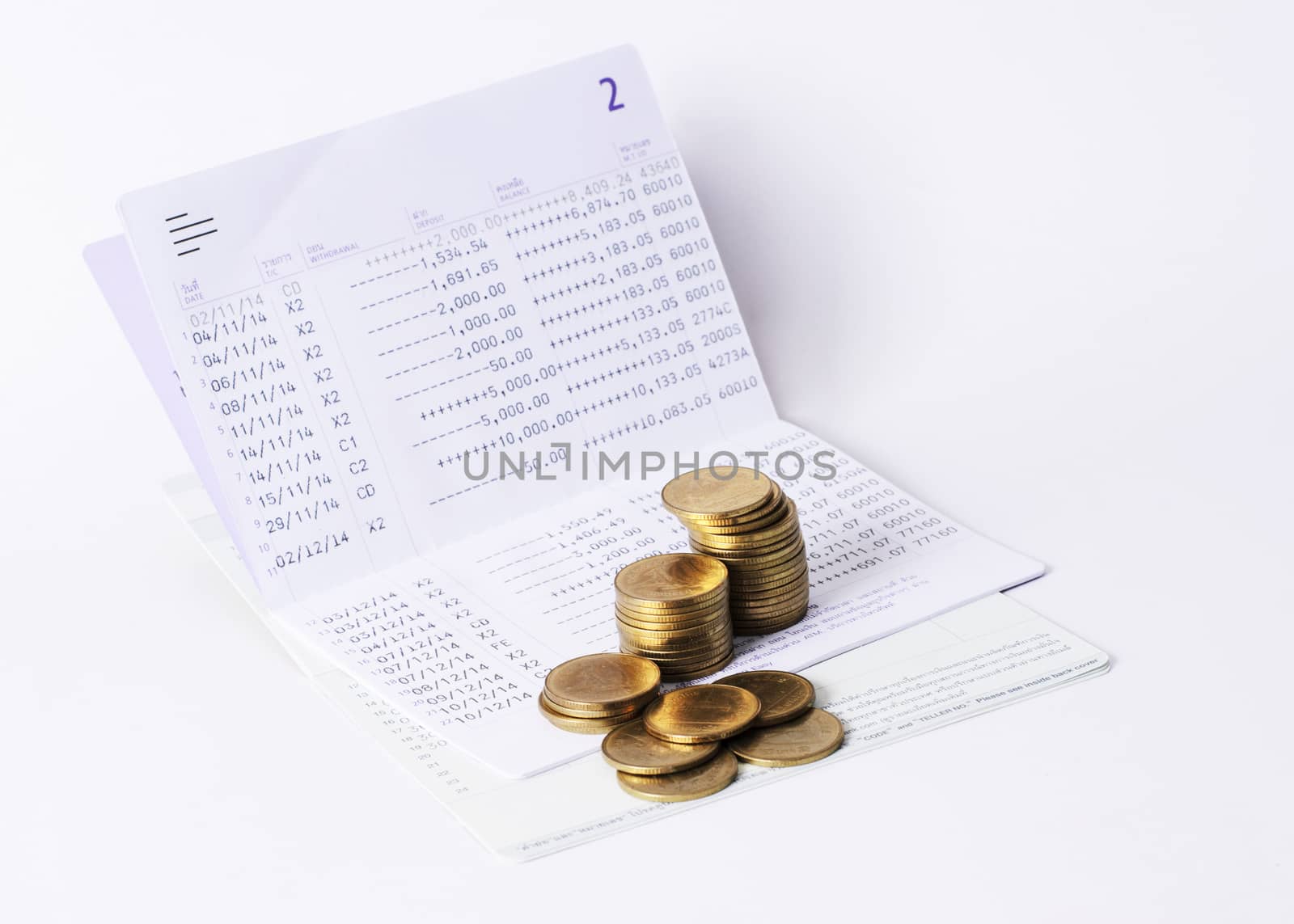 Money Coins stack and book bank saving plan for loan concept