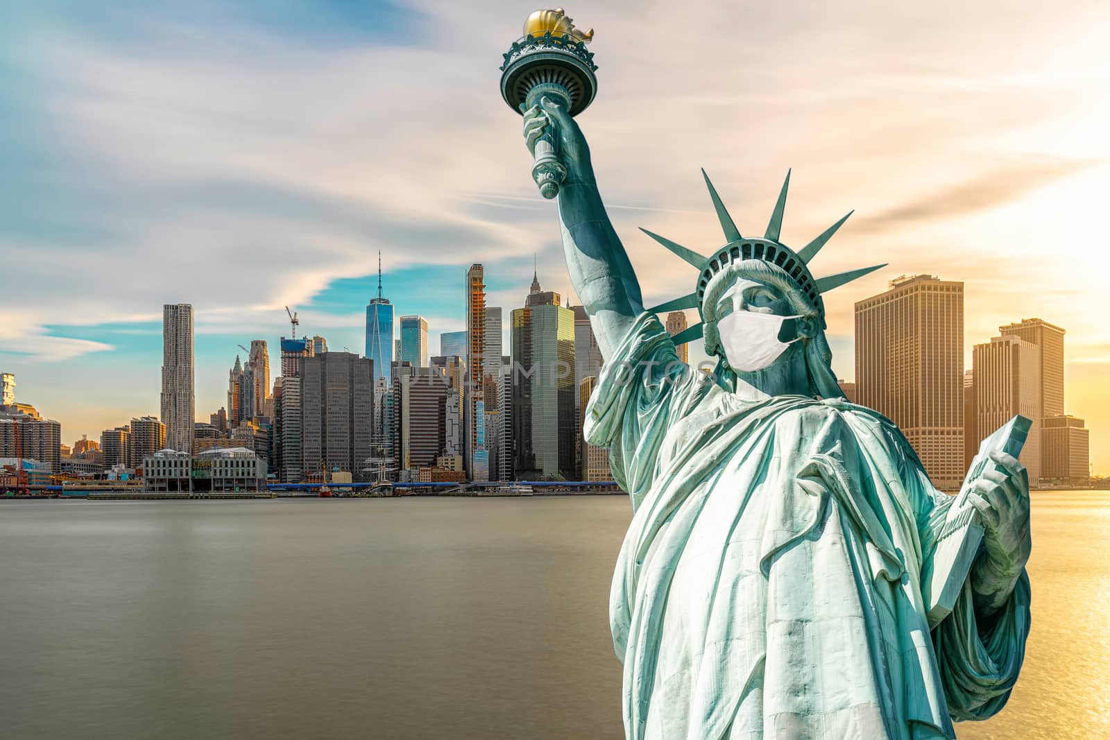 The Statue of Liberty wearing surgical mask when Covid-19 Outbreak over the Scene of New york cityscape river side, united state, coronavirus pandemic, Architecture and building with tourist concept