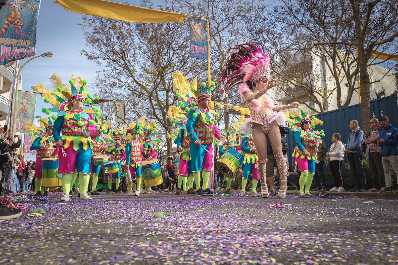 Loule, Portugal - February 25, 2020: percussionists parading in the street accompanying dancers in the parade of the traditional carnival of Loule city on a February day