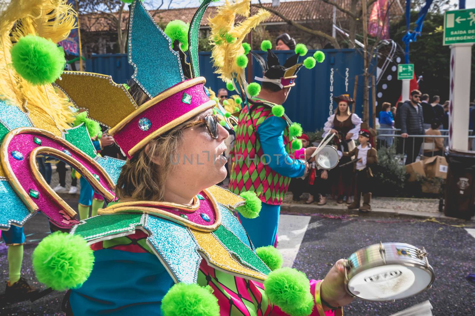 Loule, Portugal - February 25, 2020: percussionists parading in the street accompanying dancers in the parade of the traditional carnival of Loule city on a February day