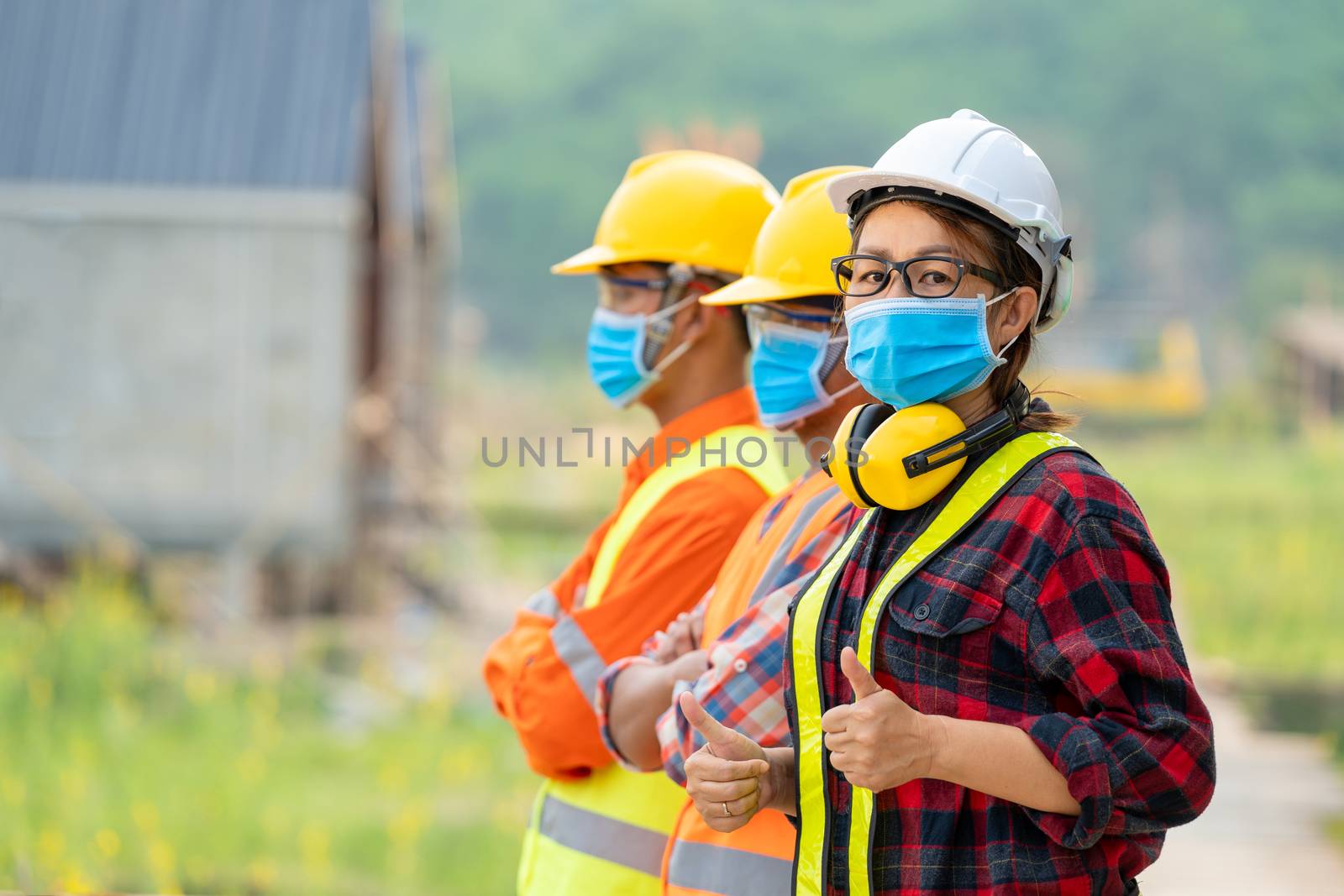 Worker wearing protective mask to Protect Against Covid-19. by Visoot