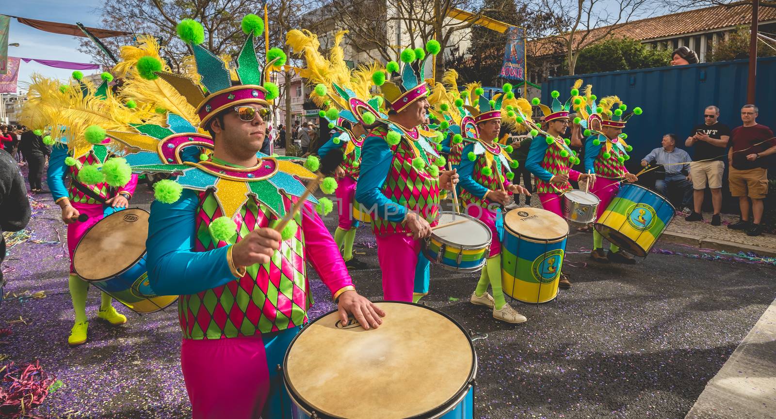 Loule, Portugal - February 25, 2020: percussionists parading in the street accompanying dancers in the parade of the traditional carnival of Loule city on a February day