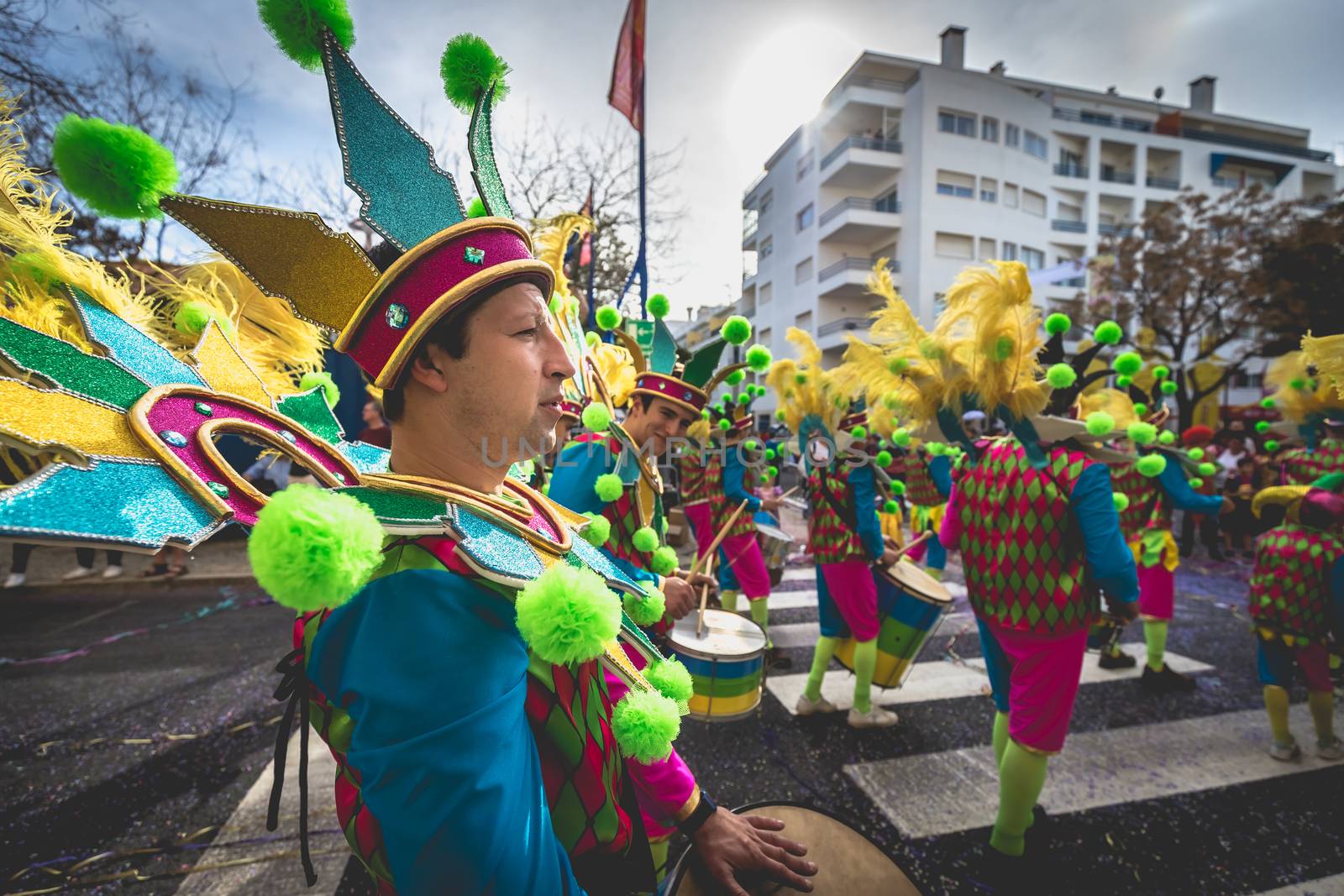 Loule, Portugal - February 25, 2020: percussionists parading in the street accompanying dancers in the parade of the traditional carnival of Loule city on a February day