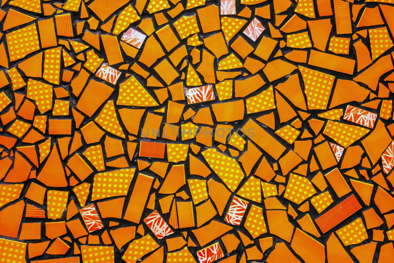 Broken ceramic tiles mosaic seamless tile-shard pattern background yellow orange colors