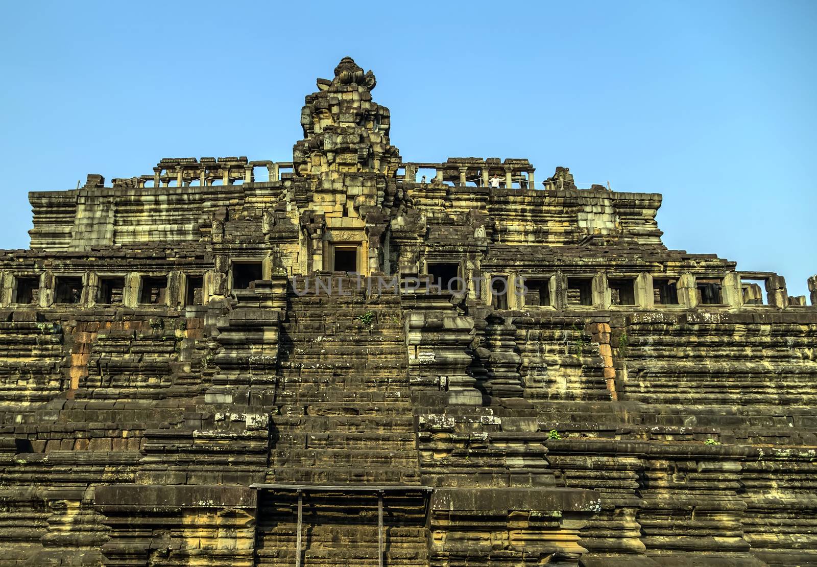 Ancient temple old ruin stone wall of Angkor wat Lost Khmer city in the jungle Siem Reap UNESCO World Heritage Site Cambodia.