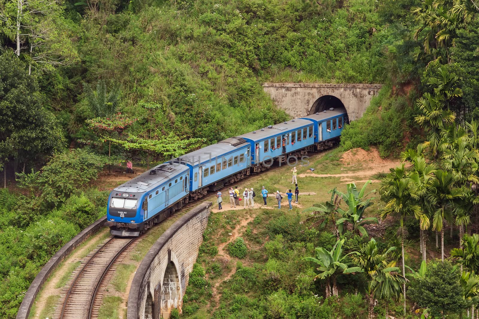 Trains pass. Kandy to Ella train crossing Nine Arches Bridge tunnel Demodara in Sri Lanka