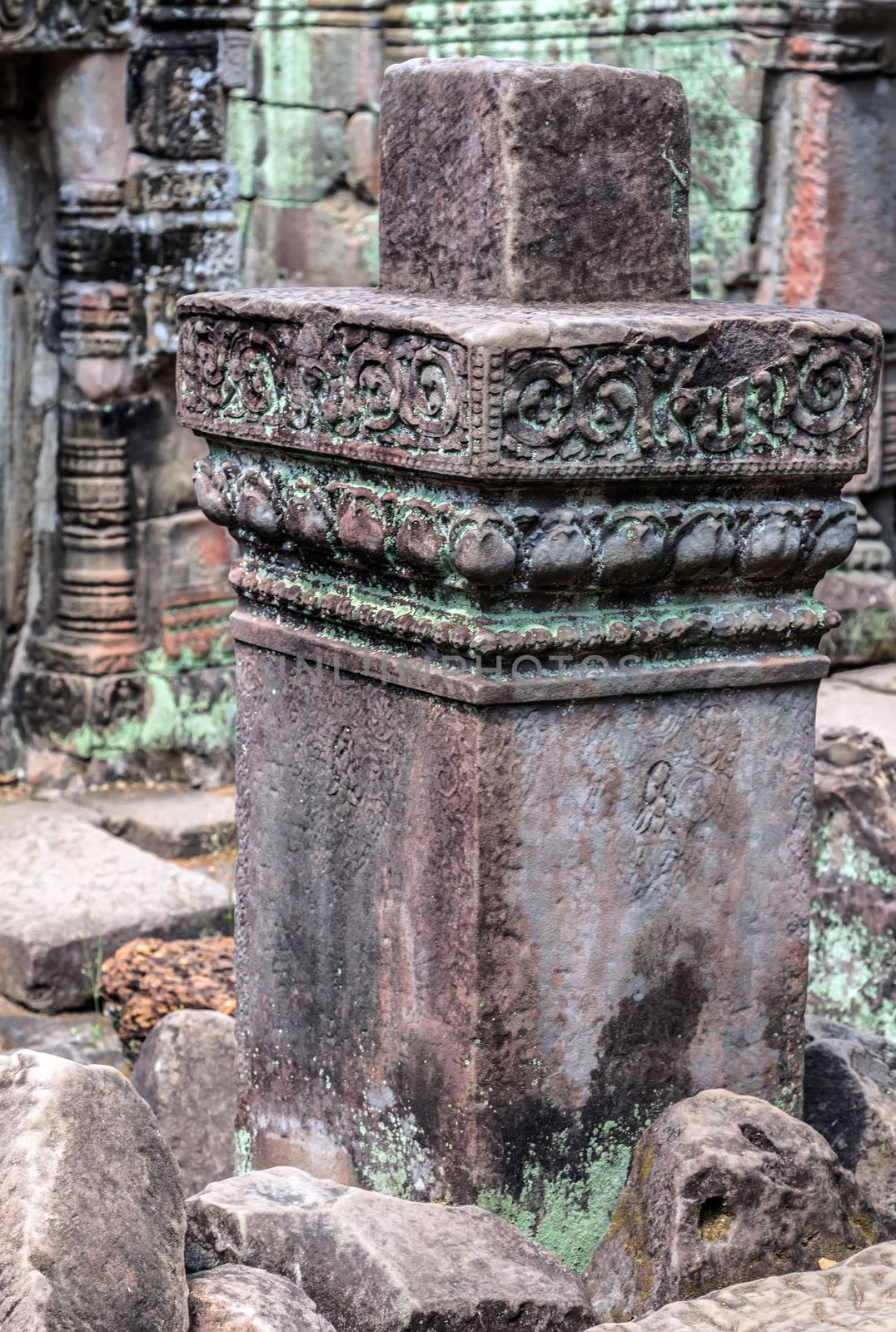 Low relief carving decorative sanctuary sculpted elements Ancient bas-relief decorated temple old ruin stone wall of Angkor wat complex Siem Reap UNESCO World Heritage Site Cambodia.