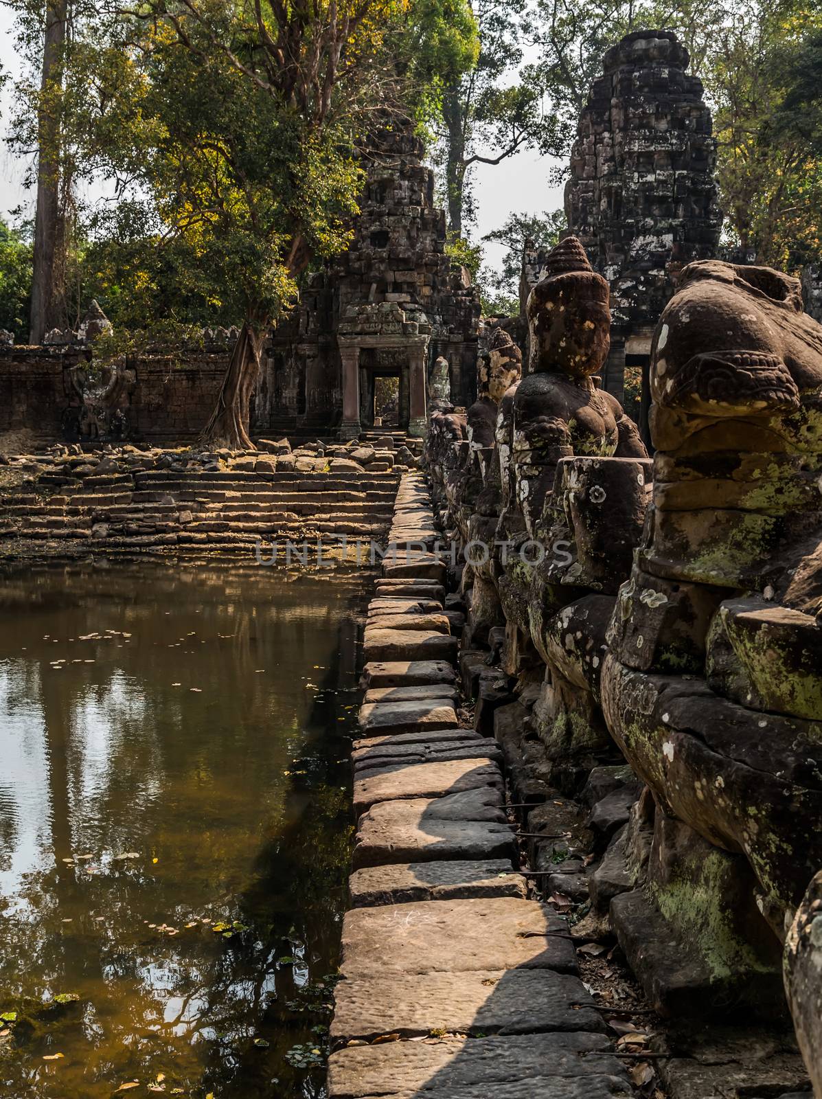 Ancient temple old ruin stone wall of Angkor wat Lost Khmer city in the jungle Siem Reap UNESCO World Heritage Site Cambodia.