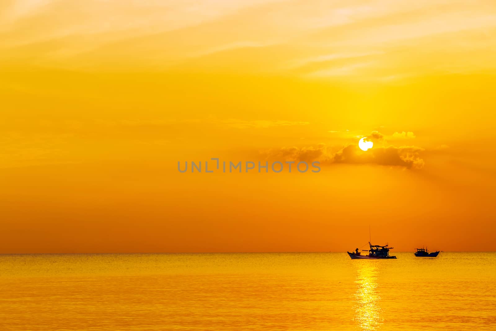 Fishing Boat seascape clouds over the water. fishing boat in the sea