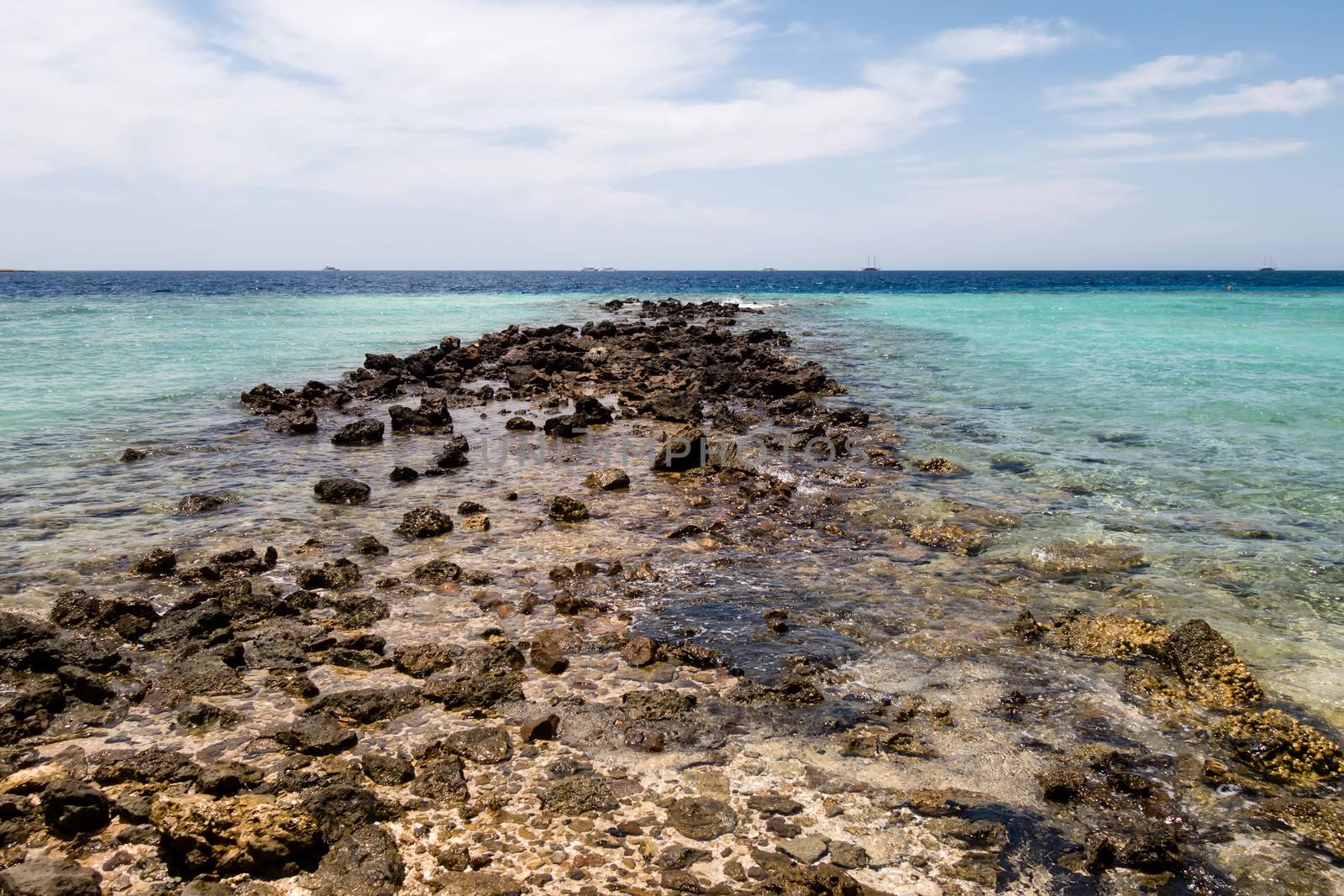 Red Sea desert landscape rock coast Ras Muhammad National Park. City of Sharm El Sheikh, Sinai Peninsula. Famous travel destionation in desert Egypt.
