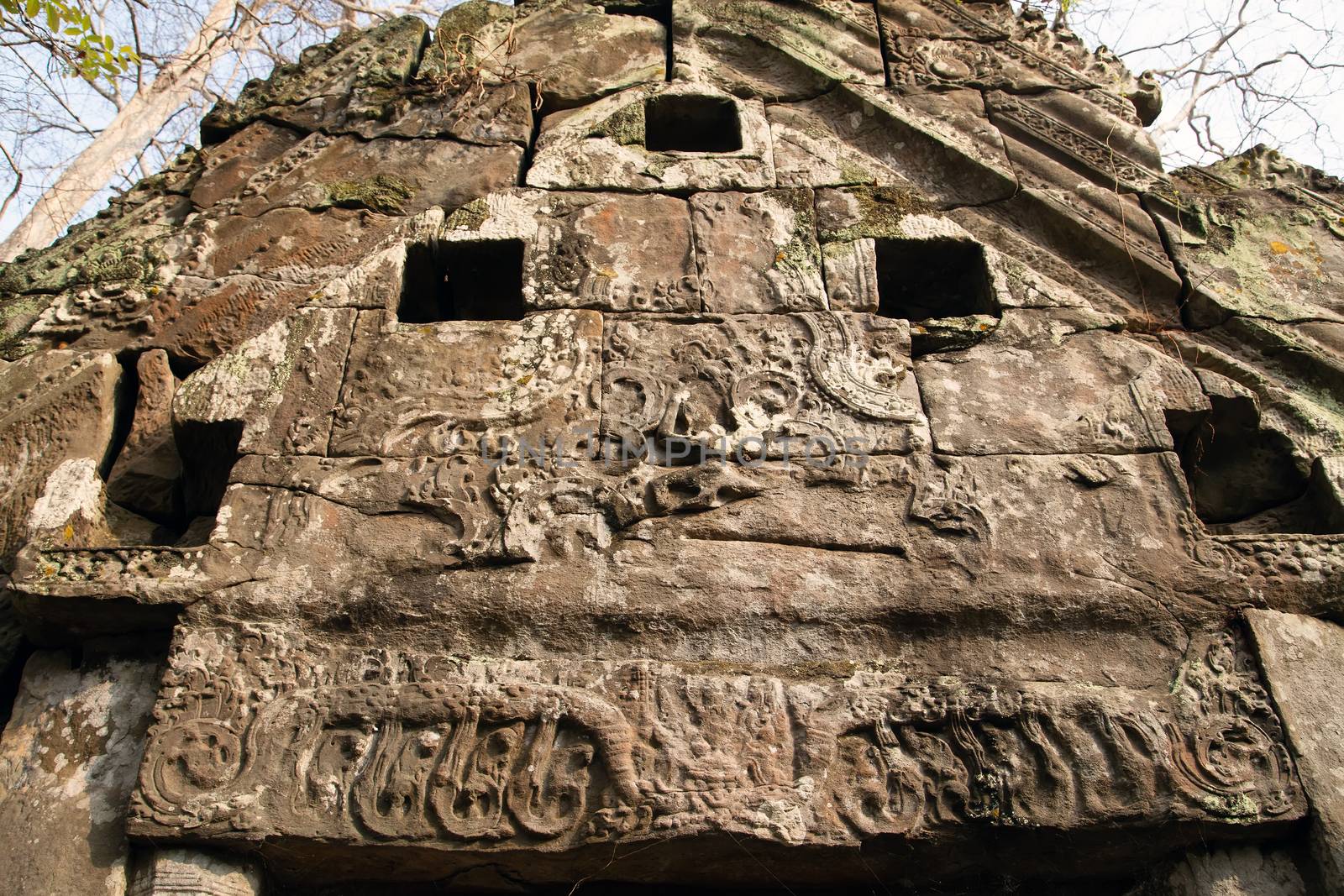 Prasat Krahom red bricks Hindu Temple in Koh Ker. Moss on the stone brick sandstone laterite blocks archaeological Landscape of Koh Ker, Northwest Cambodia