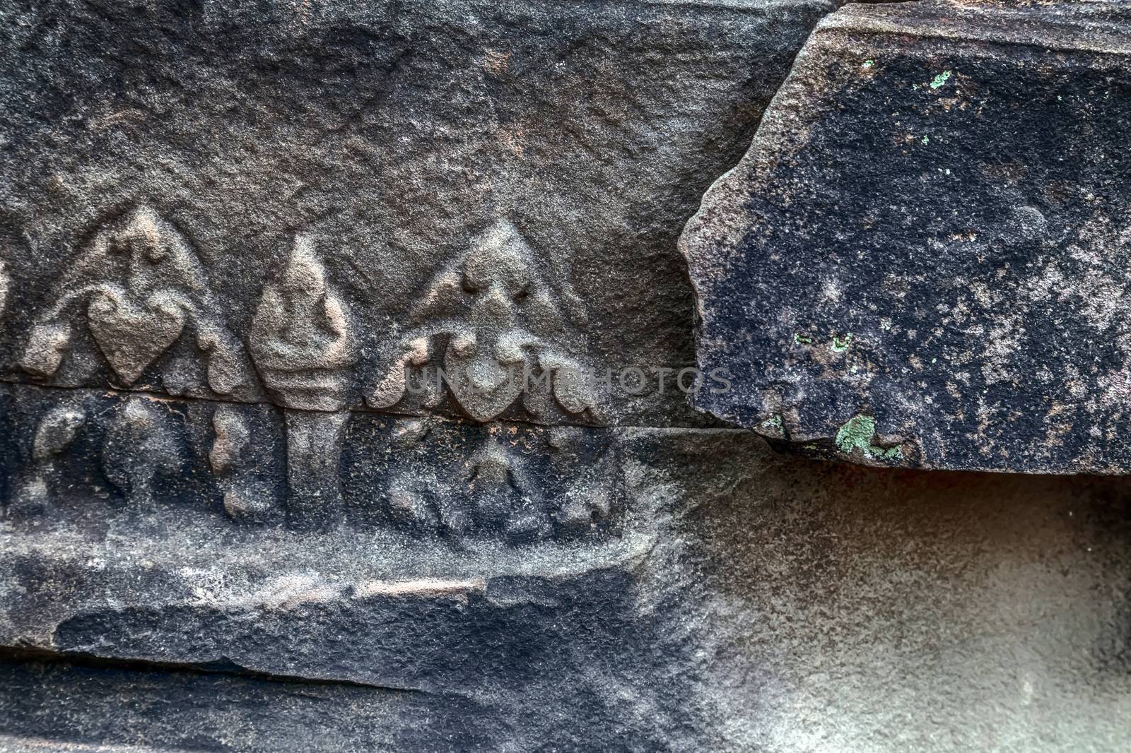 Banteay Srei Bas-reliefs are individual figures jungles of ruins Angkor. Banteay Srey temple Angkorian sites in Cambodia.