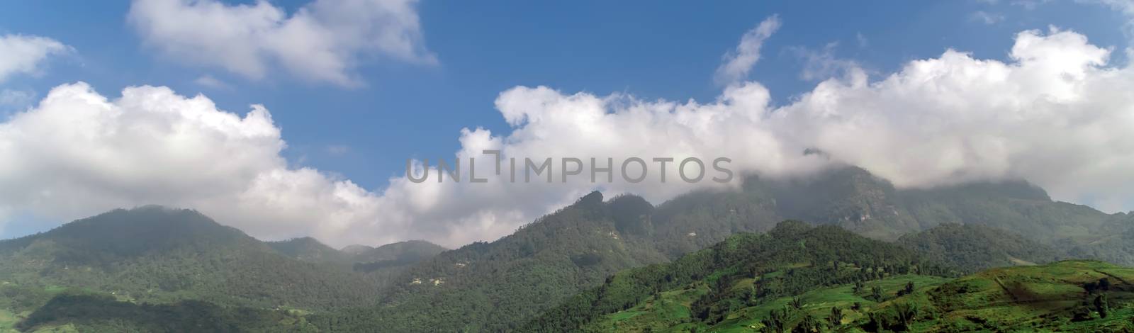 Mountain cloud top view landscape range view. Mountain peak blue sky white clouds panorama. Vietnam landscapes.