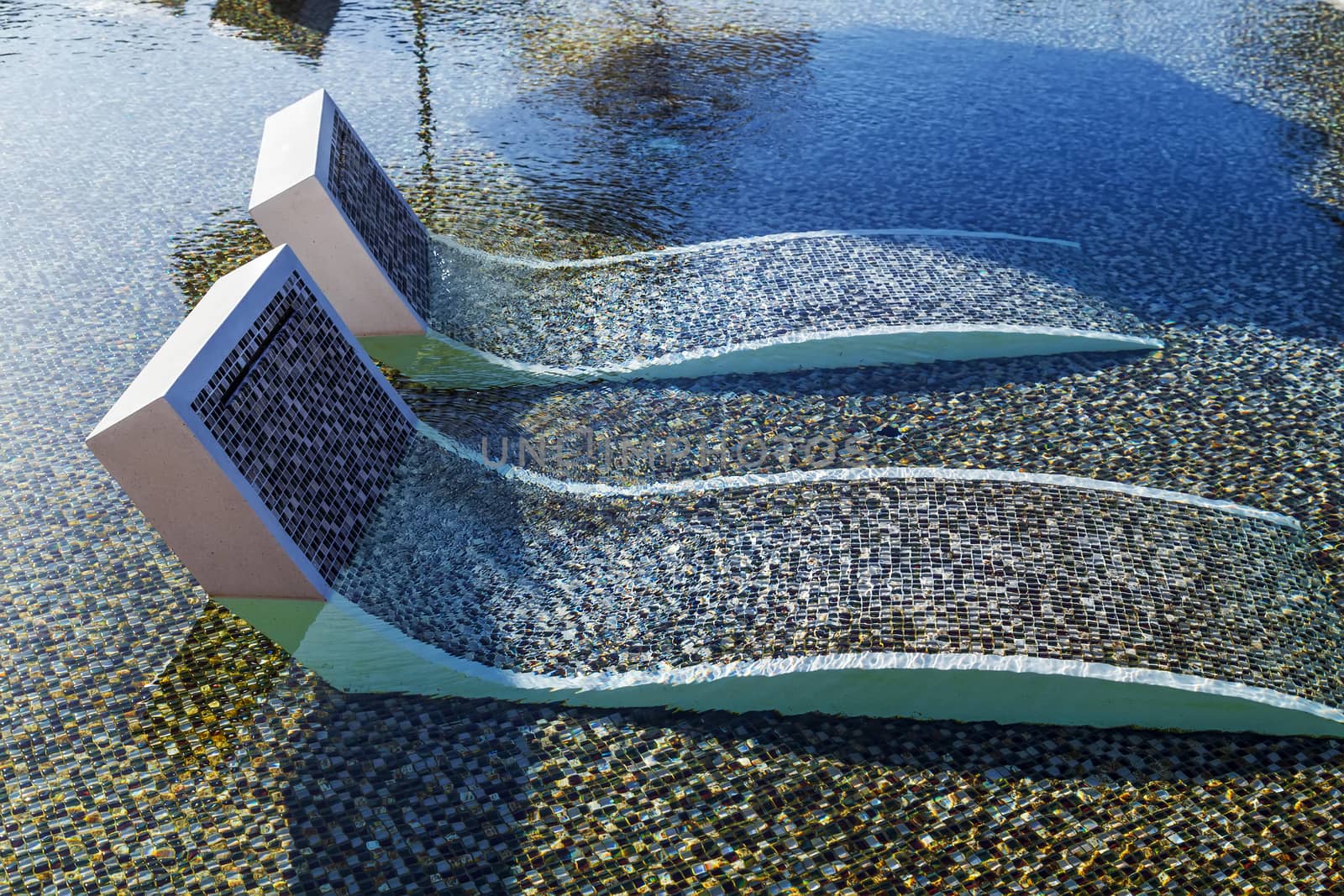 tropical resort hotel with swimming pool. Beach chair tile floor marble ceramic mosaic.