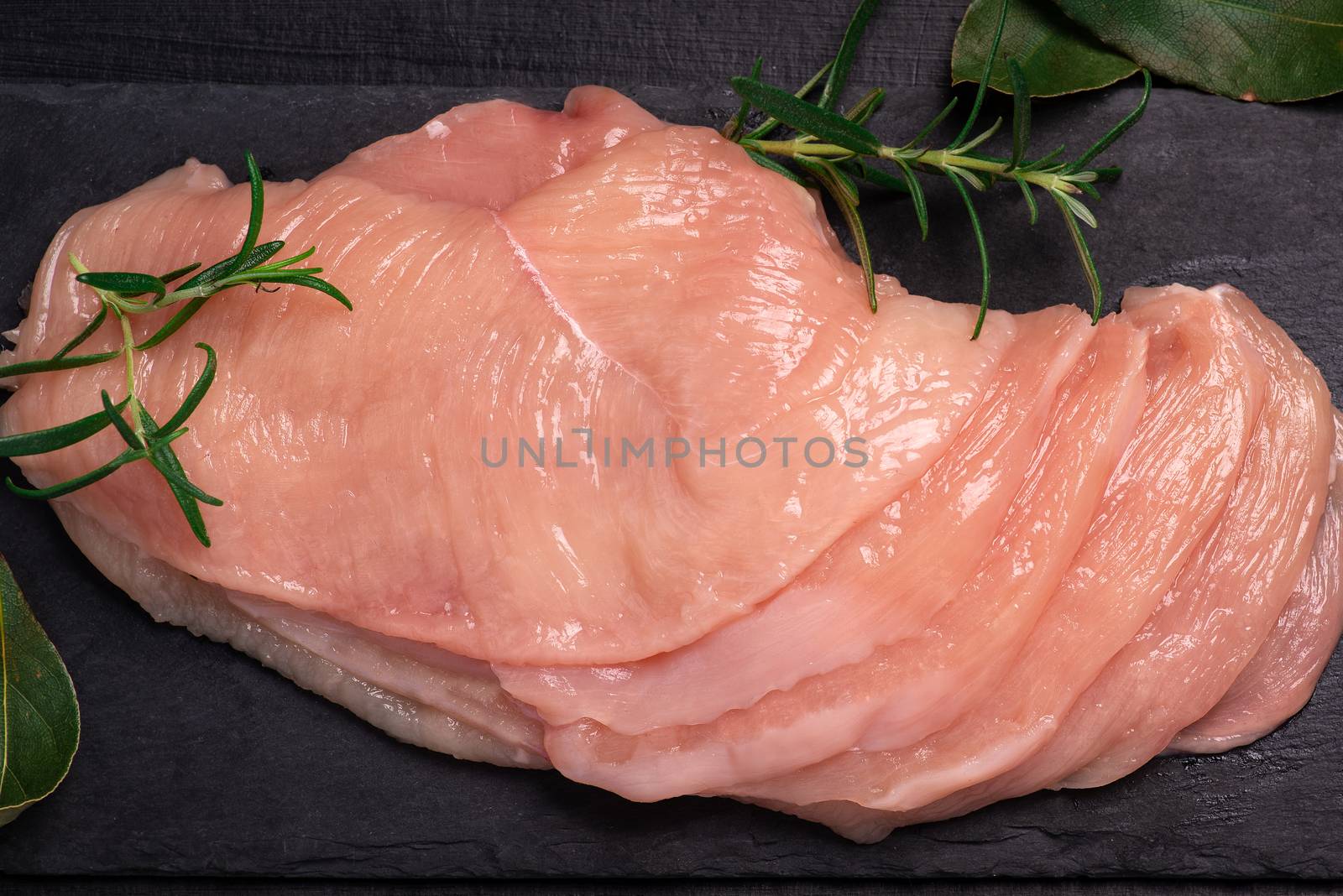 Raw sliced chicken meat close-up. Sotilissimo. Close-up view of raw, fresh, choped and sliced chicken meat.Delicious dietary meat. Cooking. by nkooume