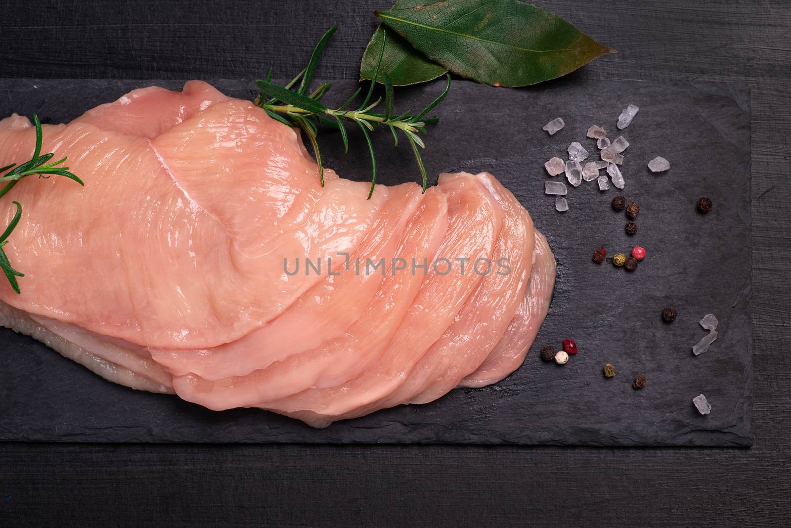 Raw sliced chicken meat close-up. Sotilissimo. Delicious dietary meat. Cooking,food of meat and fillets.Close-up view of raw, fresh, choped and sliced chicken meat.