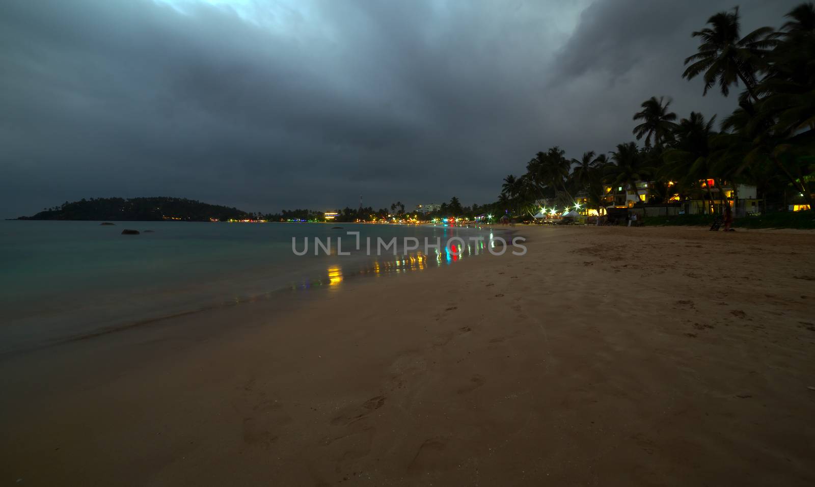 Sunset view of tropical restaurants. Ocean coast of Mirissa, Sri lanka