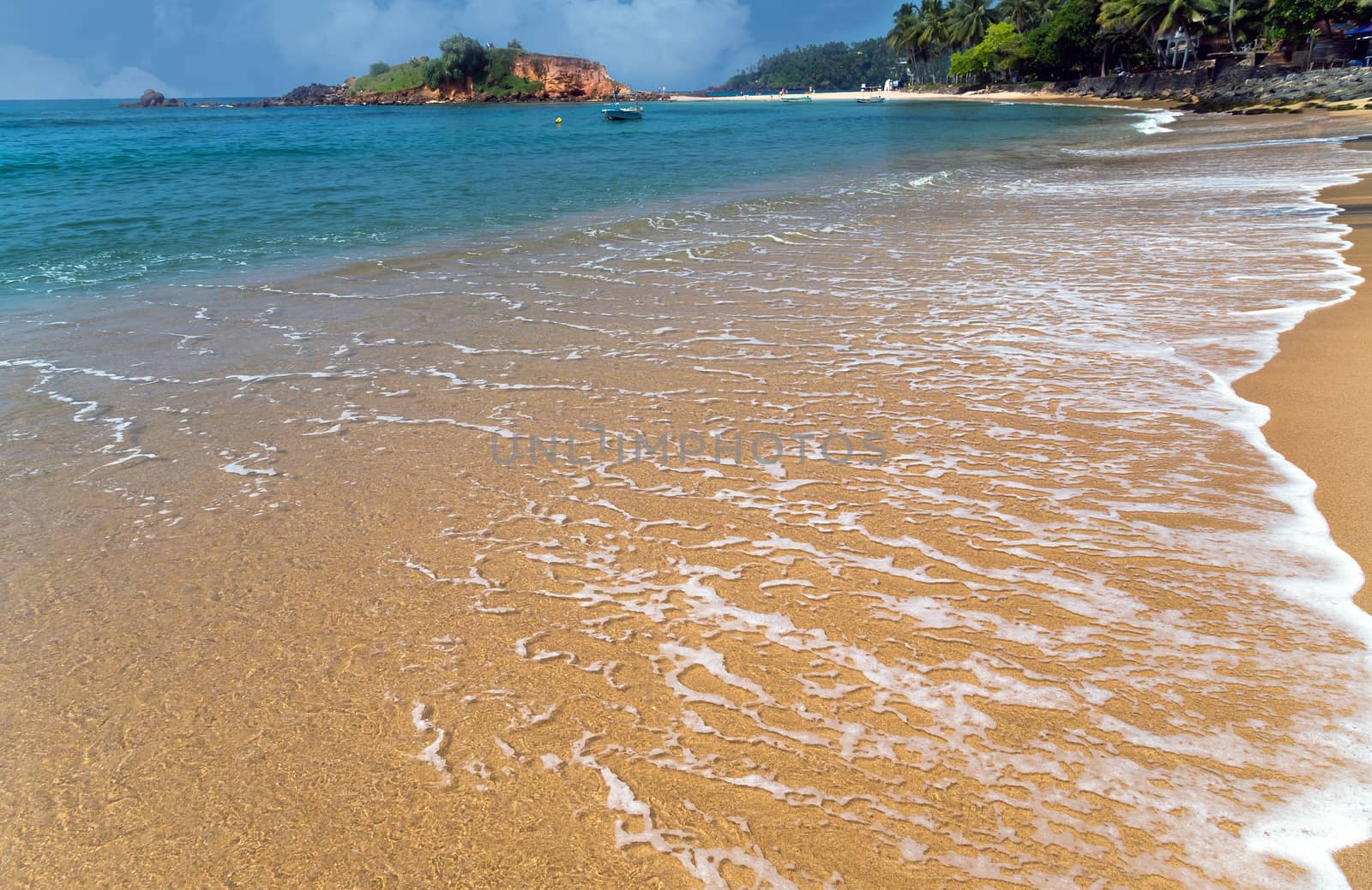 Beautiful bay with white sand beach, blue water, Parrot Rock Mirissa Sri Lanka