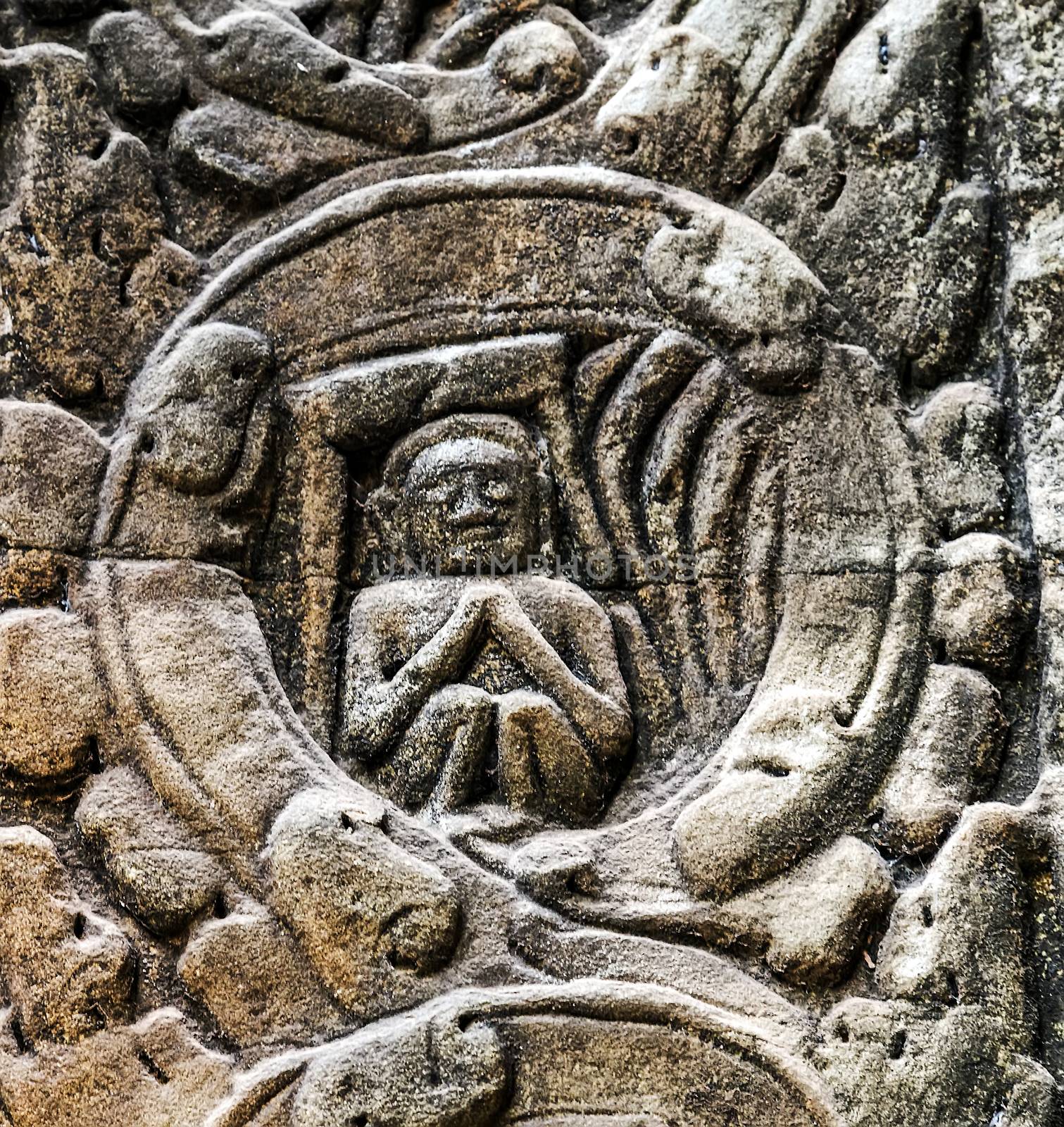 art of ancient Hindu god stone background, detail of the architecture in Bantey Srei temple in the Angkor area, Cambodia.