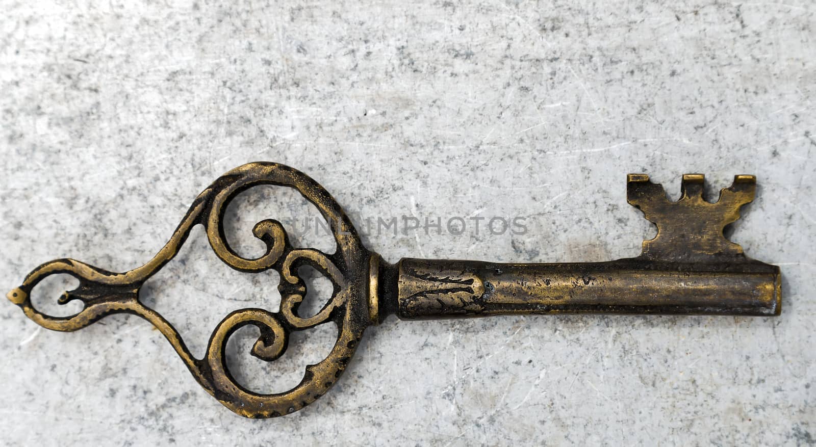 old key bronze background on marble