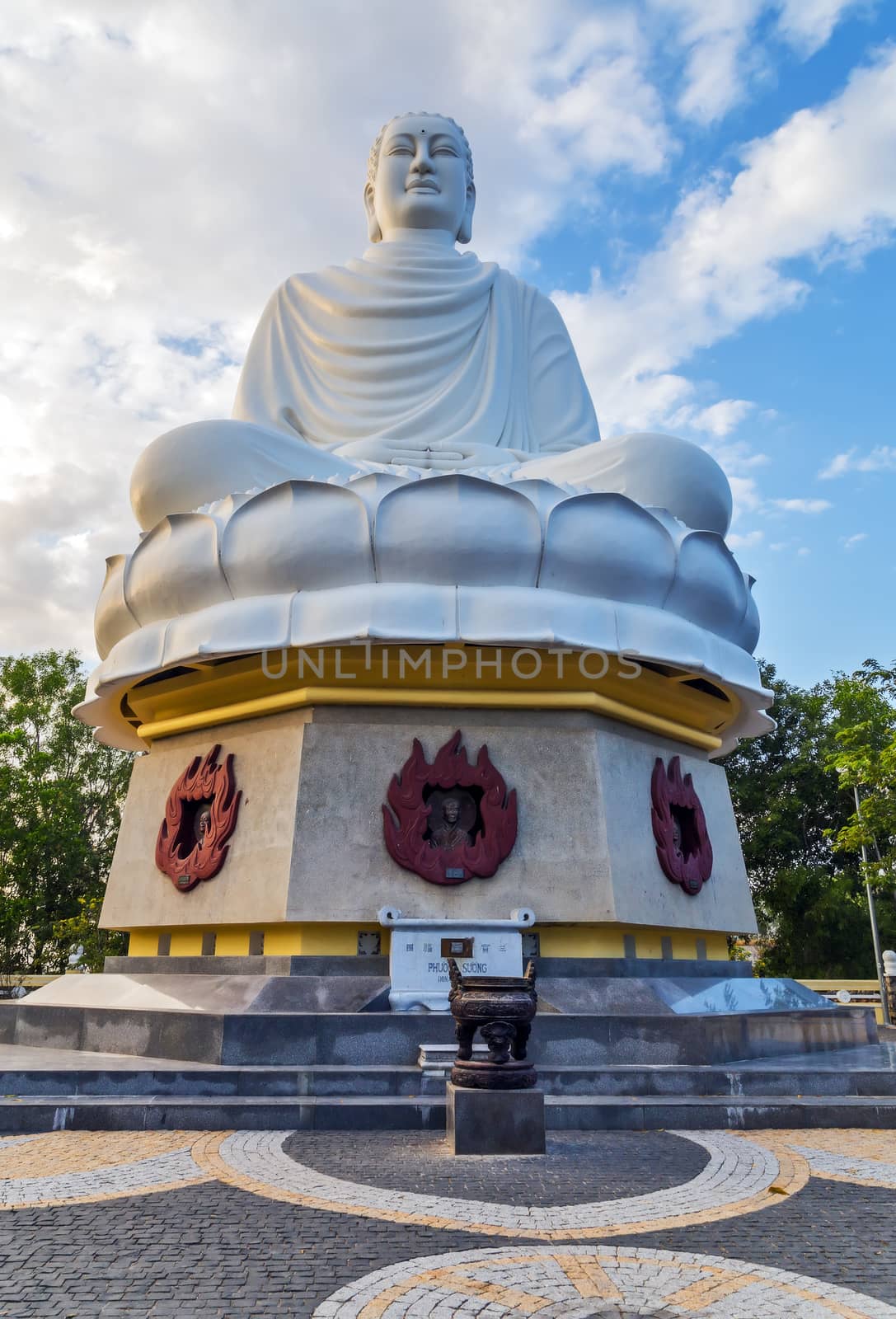 meditating Buddha statue in marble lotus