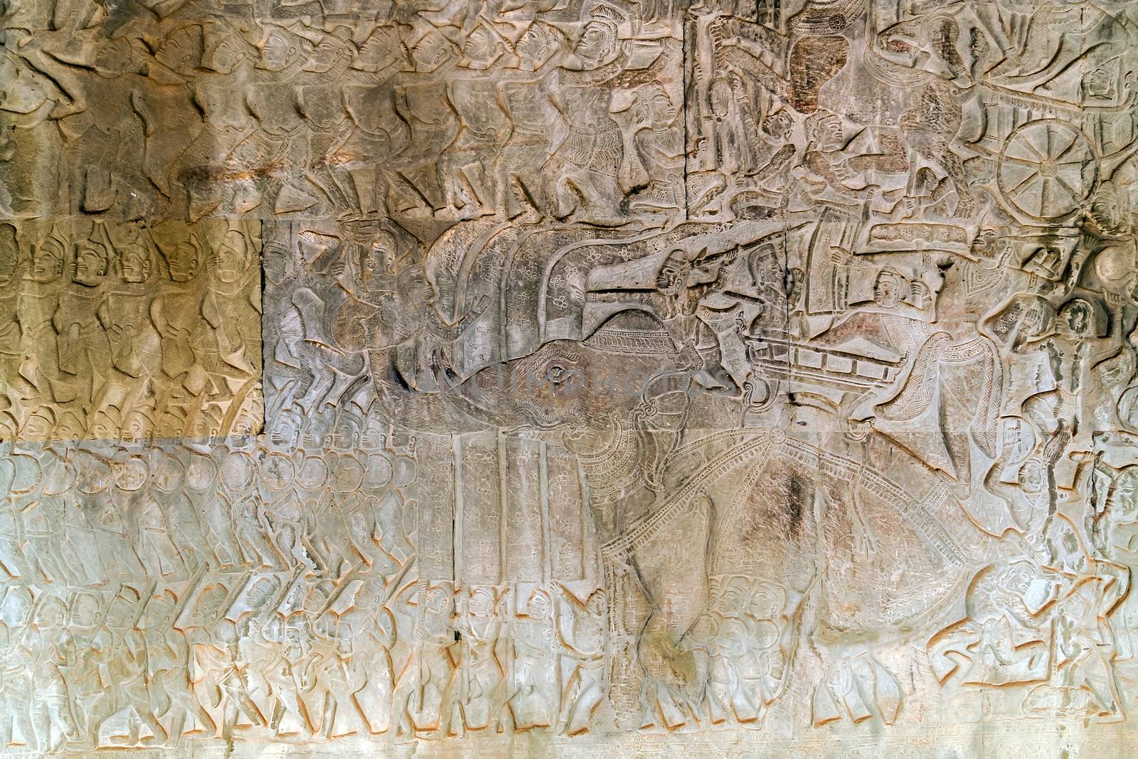 Khmer relief carving of gods fighting demons. Inner wall of the temple of Angkor Wat, Siem Reap, Cambodia.