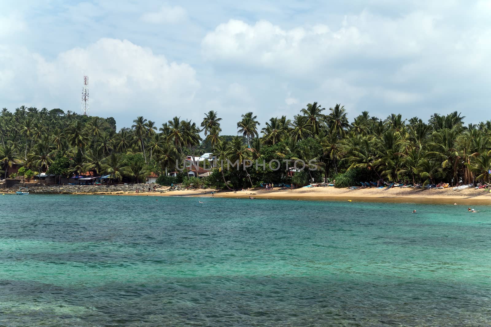 Tropical beach and turquiose ocean. Sri Lanka Vacation at Paradise.